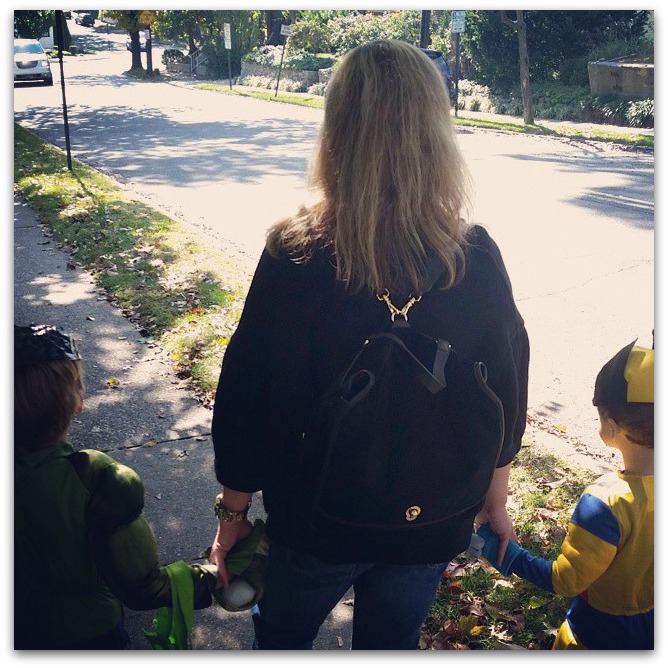 That's me taking the kids trick-or-treating with the Etienne Aigner Porter Backpack.