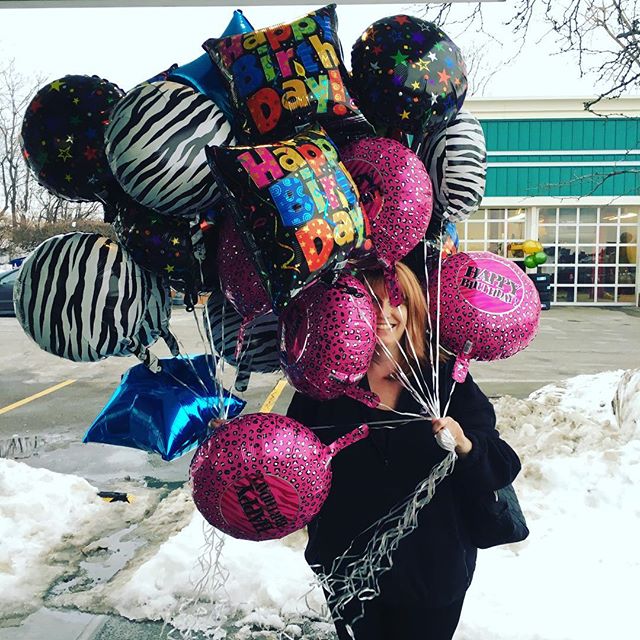Woman holding Colorful ballons for a party