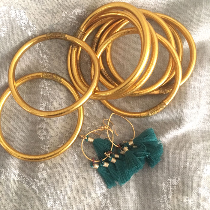 gold-bracelets-and-tassel-earrings