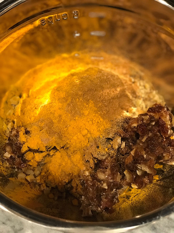mixing ingredients Turmeric Holiday Spice Balls