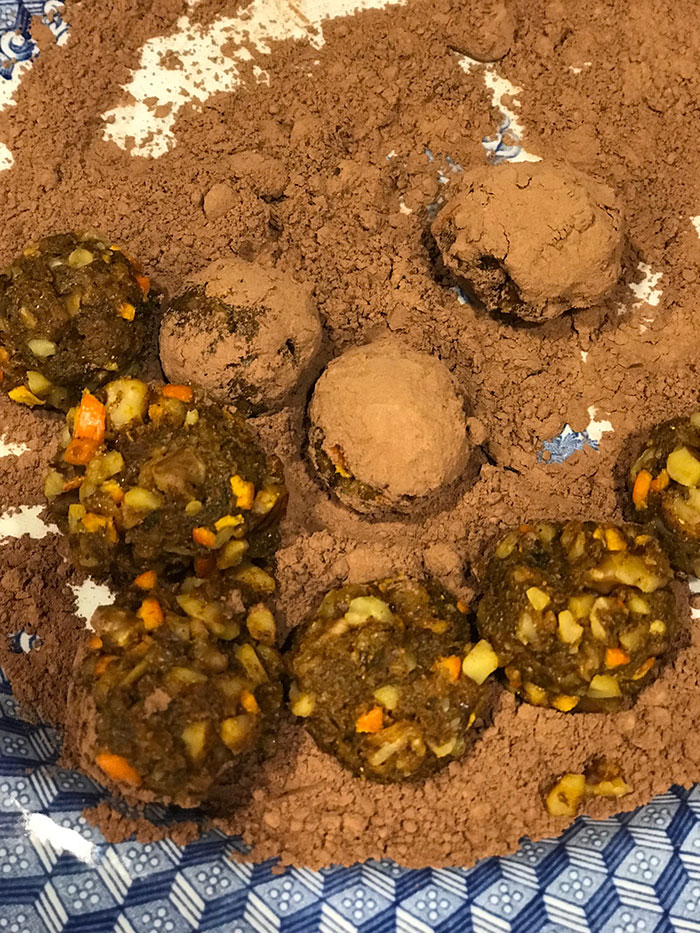 roll the turmeric balls in cocoa powder