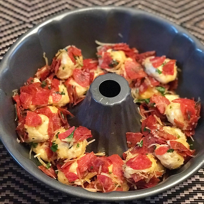 Kid Friendly Pepperoni Pizza Monkey Bread in bundt pan before baking