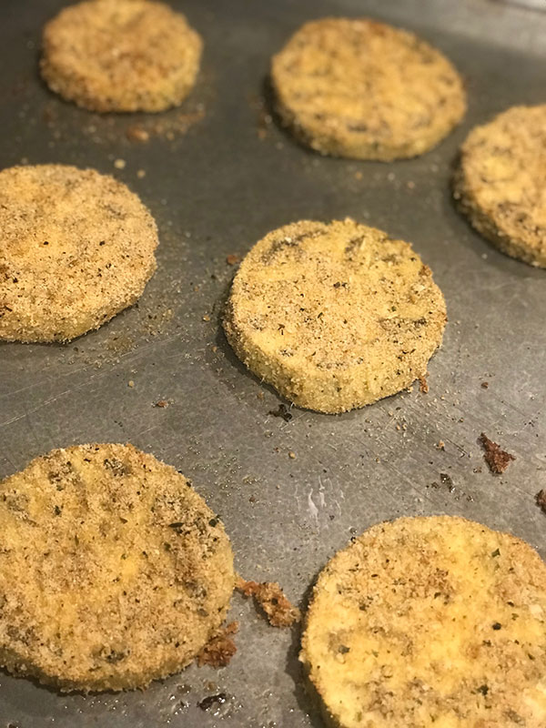 breaded sliced eggplant on cookie sheet fountainof30