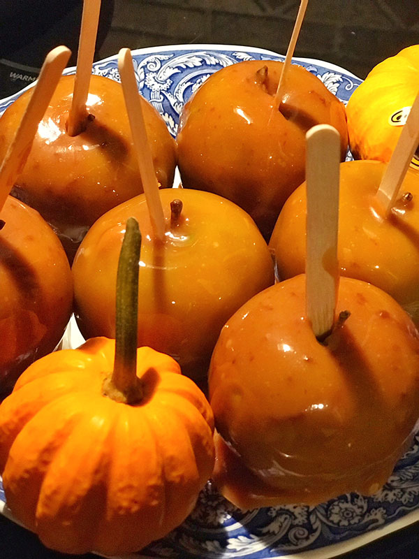salted caramel apples recipe serving on a plate with gourds