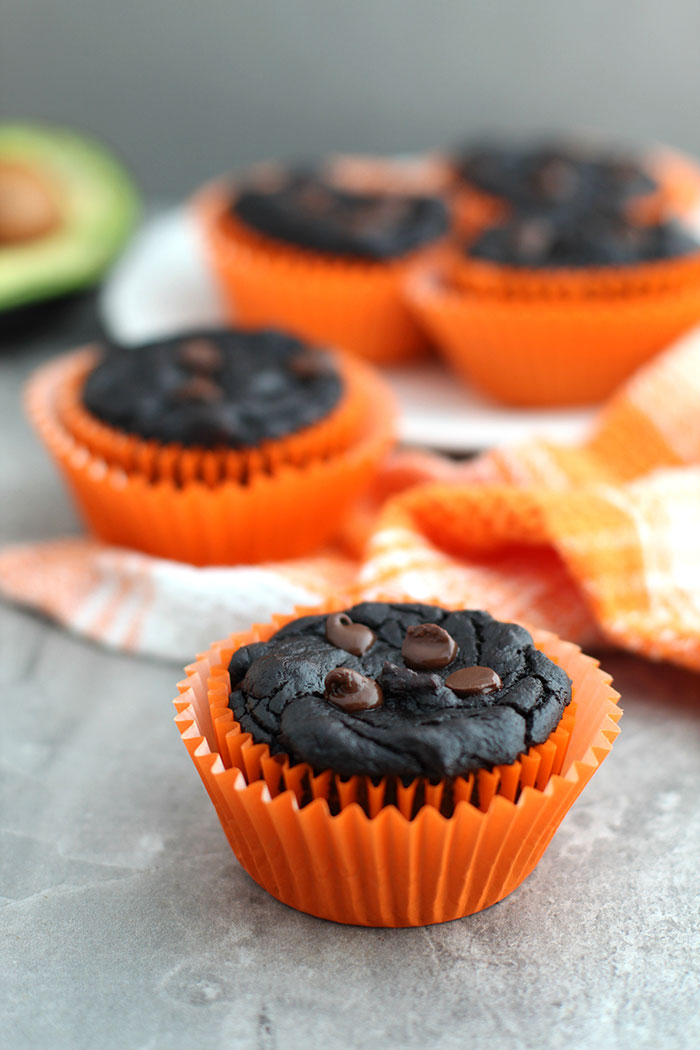 Healthy Pumpkin Chocolate Brownie Muffins in orange paper muffin cups