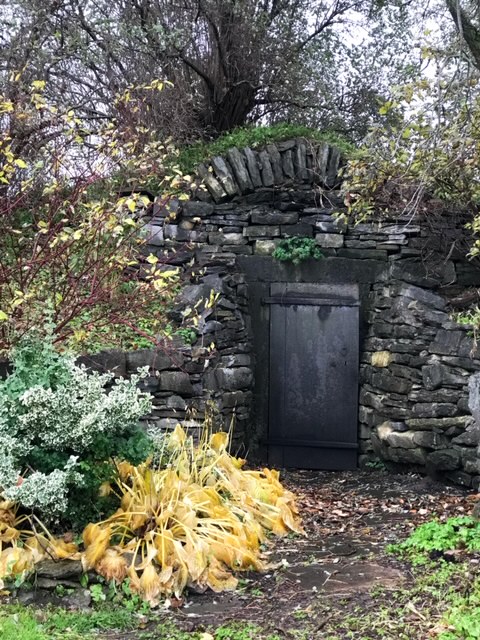 Beekman 1802 Farm Crypt door stone wall and trees