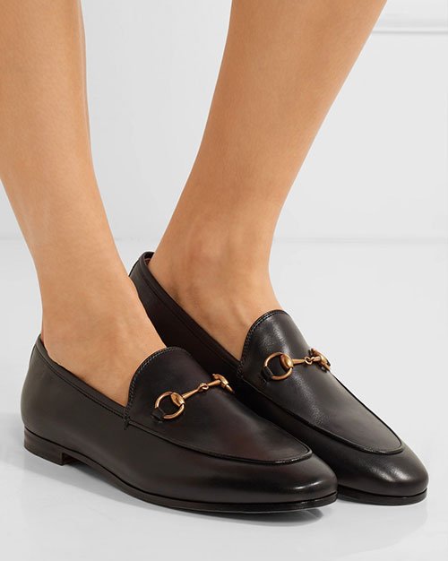 making a big purchase gucci horsebit black loafers on feet