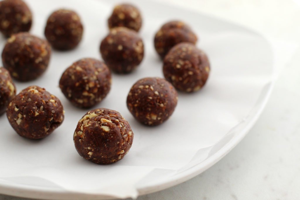 Gingerbread Energy Bites Rolled on parchment a Plate