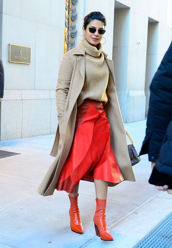 most stylish celebrities of 2019 Priyanka Chopra in camel MaxMara Coat orange leather skirt