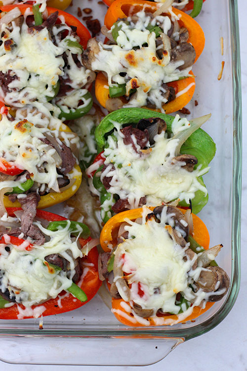 Keto Philly Cheesesteak Stuffed Peppers Recipe overhead view with melted cheese in glass pan