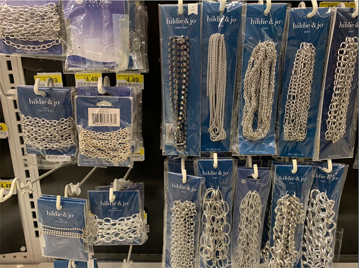 chains hanging in bags on wall in craft store
