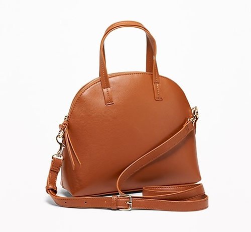 Meghan Markle Bold Color with brown handbag
