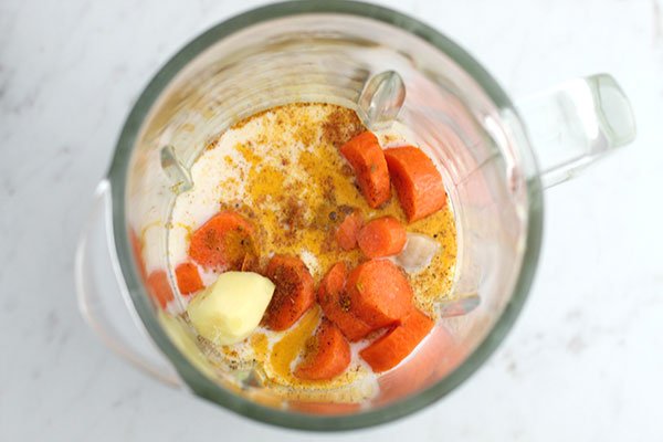 Anti-Inflammatory Golden Milk Smoothie ingredients in a blender before blending