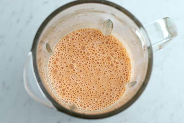 Anti-Inflammatory Golden Milk Smoothie in a blender overhead view