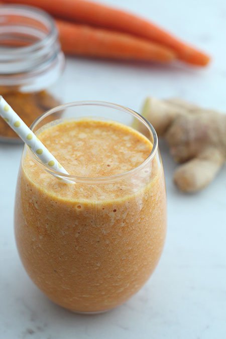 Anti-Inflammatory Golden Milk Smoothie in a glass with a straw