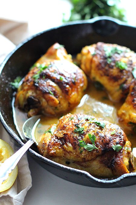 Anti-Inflammatory Turmeric Lemon Skillet Chicken with spoon