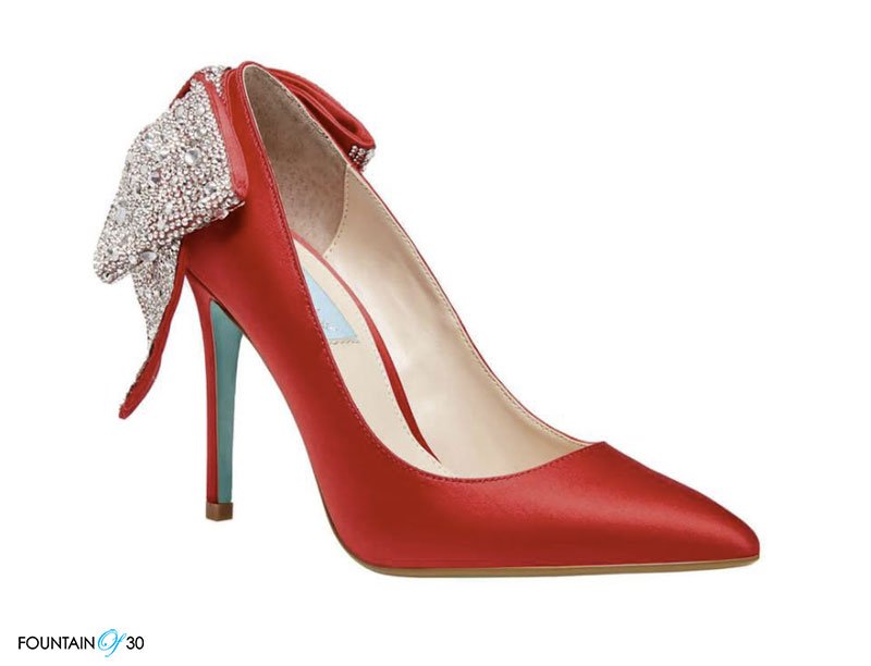 bold red pump with bow on heel