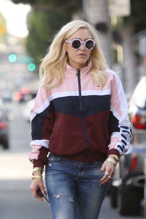 gwen stefani street style in round floral print sunglasses a colorblock sporty jacket and denim jeans