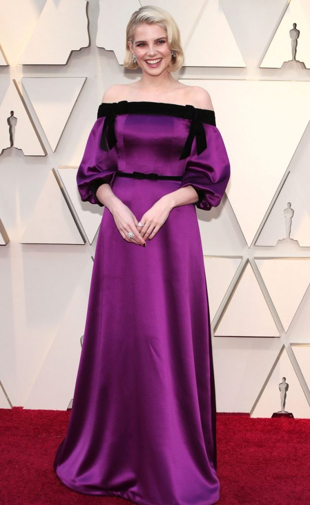 Academy Awards 2019 Fashion Lucy Boynton in purple satin gown Rodarte oscars red carpet 2019