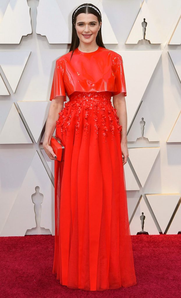 Rachel Weisz in bright red Givenchy gown with tulle floral applique and vinyl
