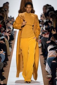 monochrome mustard coat pants turtleneck akris