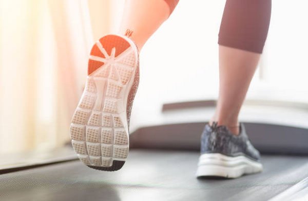 cardio woman gym shoes on a treadmill fountainof30