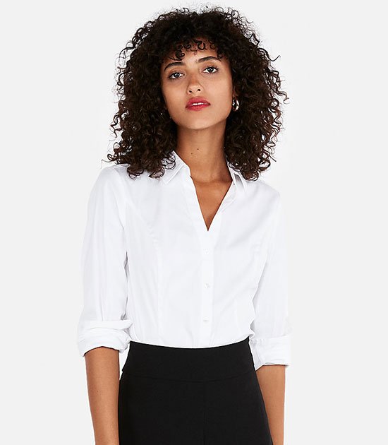 capsule wardrobe eseentials white shirt on brunette model curly hair