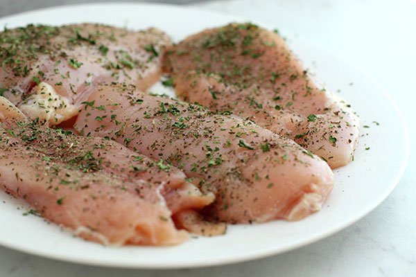 Mediterranean Chicken In a Skillet seasoned raw chicken