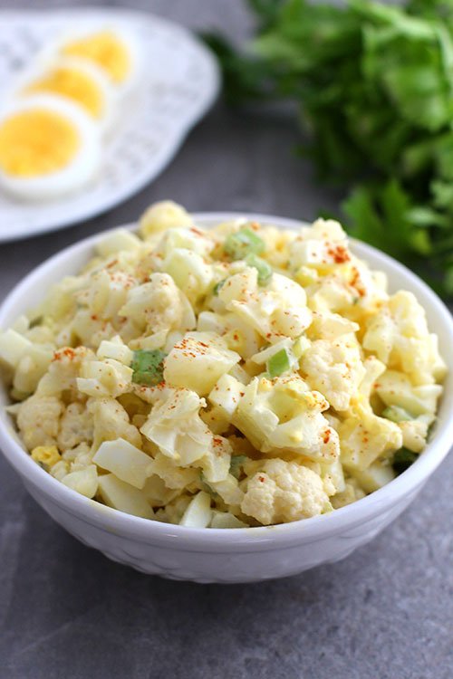low carb cauliflower potato salad serving suggestion white bowl