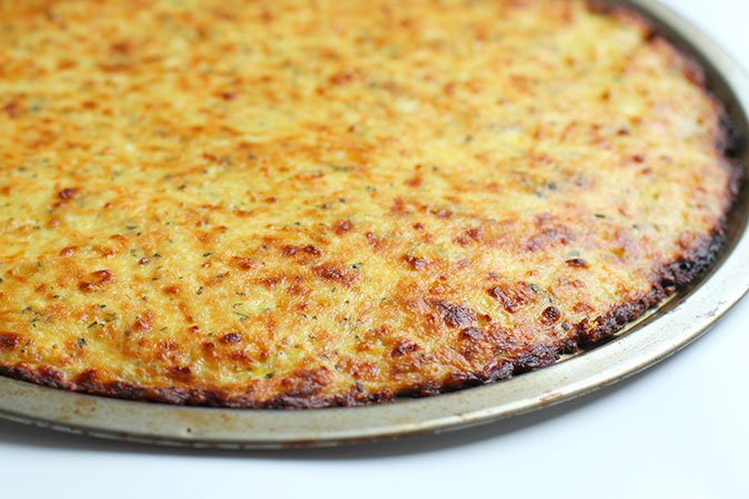 Cauliflower Pizza crust bakes in a pan fountainof30