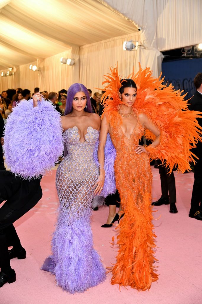 met gala Kylie Jenner in lilac and Kendall Jenner in orange Versace