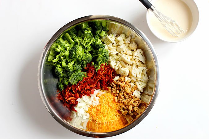 Low Carb Broccoli Cauliflower Salad ingredients in a bowl