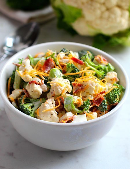 Broccoli Cauliflower Salad serving in a bowl fountainof30