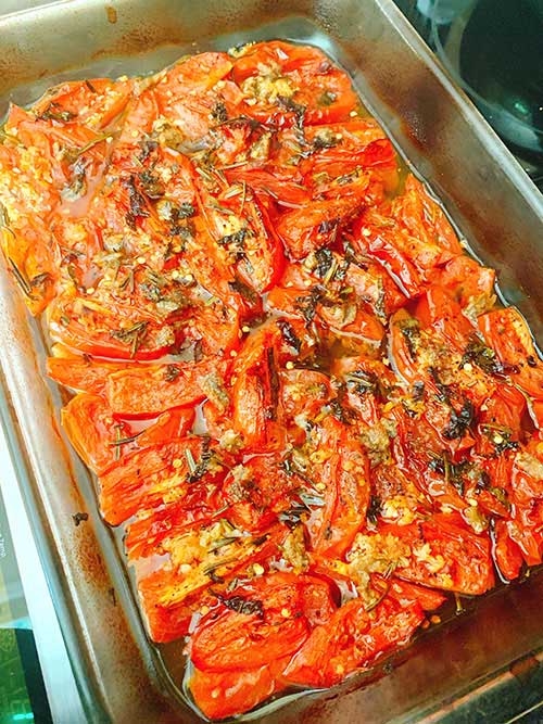 Roasted Tomatoes With Anchovies in a baking pan fountainof30