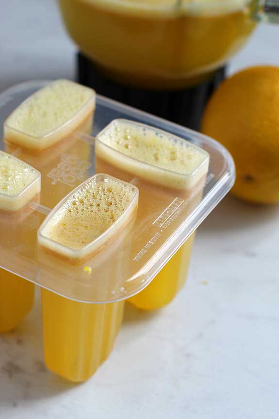 lemon liquid in popsicle molds fountainof30