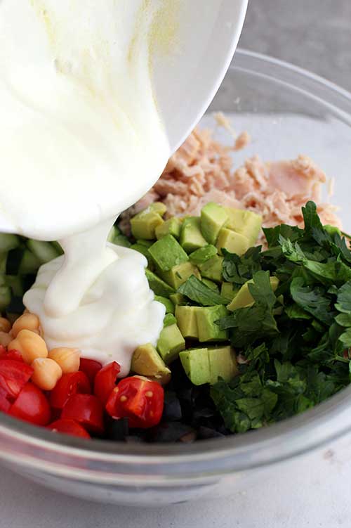Greek nonfat yogurt and lemon over tuna salad and vegetables