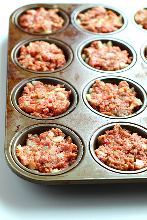meat into muffins tins