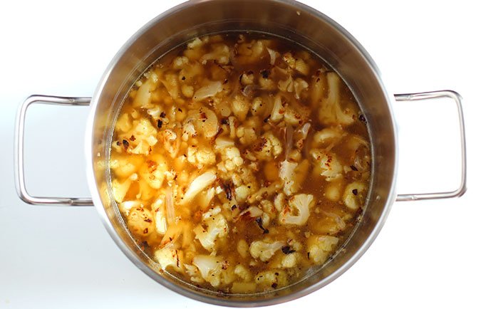 cauliflower and onion in soup pot cauliflower and onion in pot