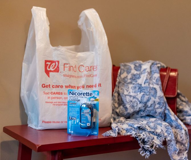 Nicorette Coated Ice Mint Lozenges with Walgreens bag on table