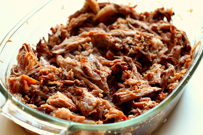 Crock-Pot Pulled Pork in a glass pan fountainof30