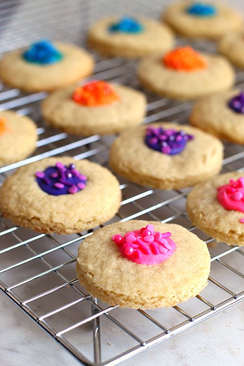 White Chocolate Thumbprint Cookies cooling on a rack fountainof30