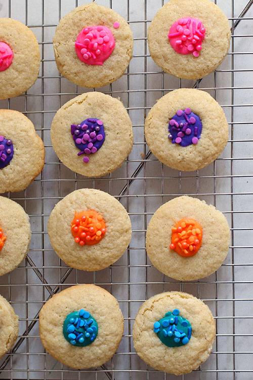 White Chocolate Thumbprint Cookies on a rack fountainof30