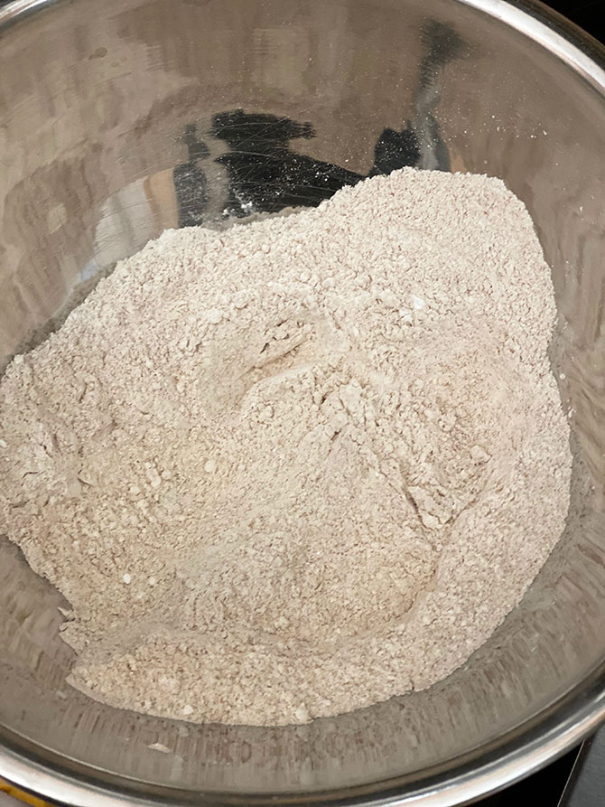 easy bread recipe flour and dry ingredients in silve bowl fountainof30