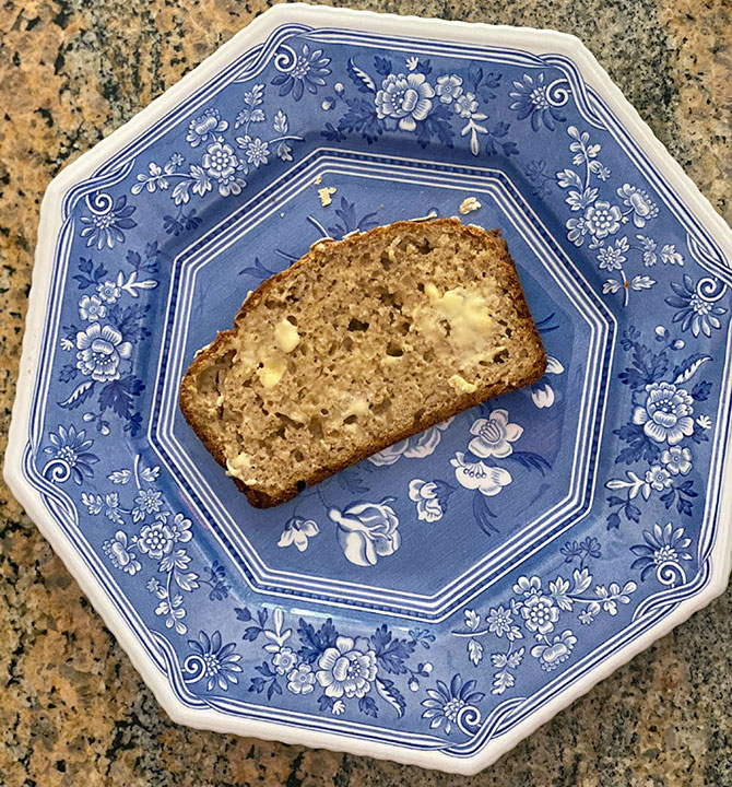 slice of homemade bread with butter on a blue plate fountainof30