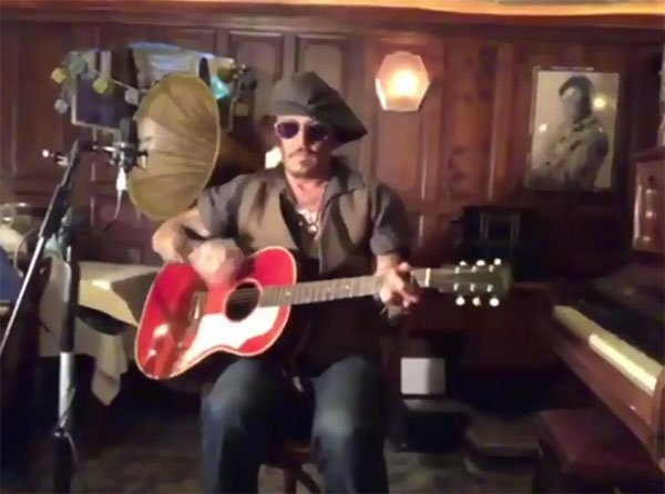 Johnny Depp on guitar singing the times are a chonging may 2020