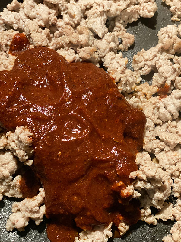 Taco Seasoning and groubd turkey in skillet