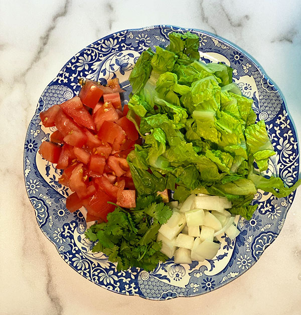 chopped tomatoes, lettuce, onions, cilantro fountainof30