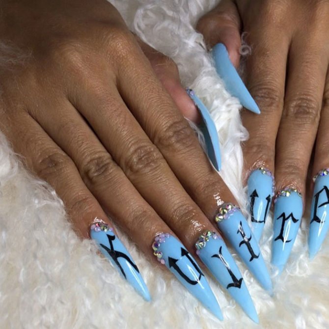 Cardi B nail art design blue with black lettering 