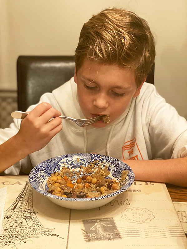 Boy eating Moroccan Beef Stew fountainof30