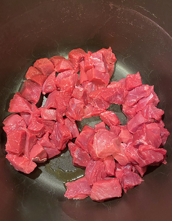 Moroccan Beef Stew lean meat cubed in pan